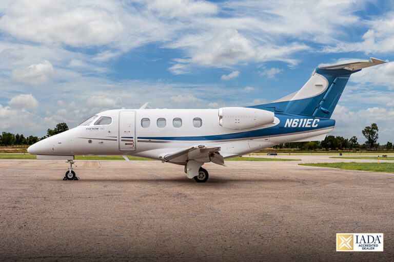 Phenom100 - N611EC-31 IADA logo